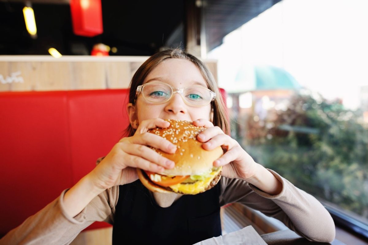 Child eating a hamburger