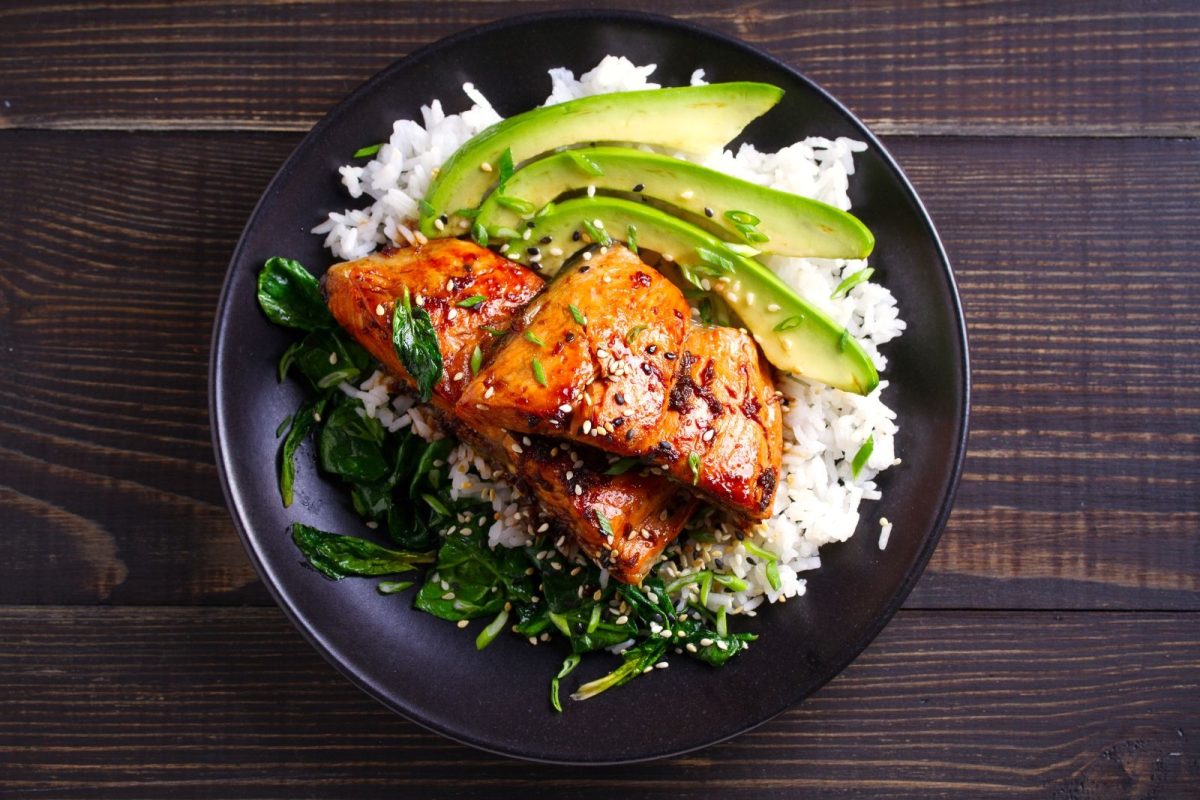 Glazed salmon with avocado.