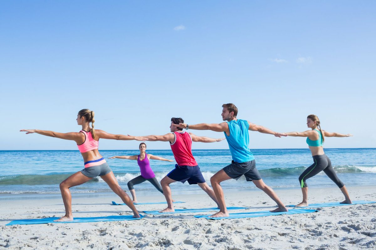 group yoga on the beach
